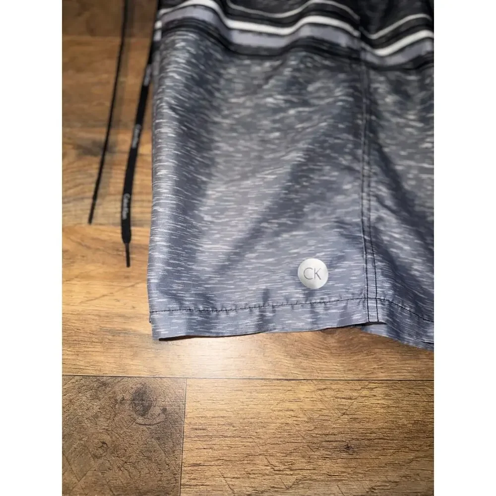 Calvin Klein men’s grey& black swim trunks